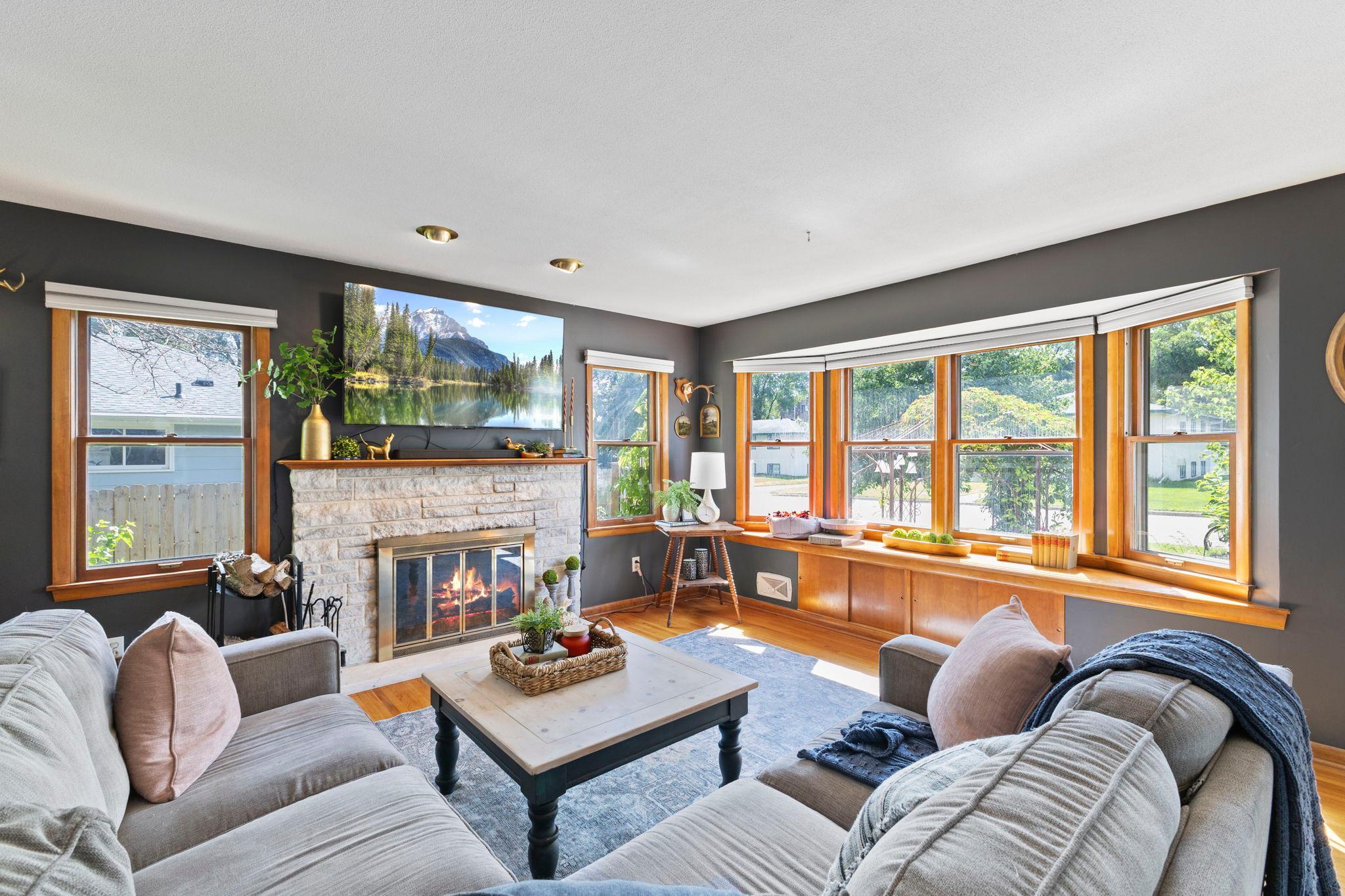 Sun-filled living spaces and a cozy fireplace create an inviting place to unwind.