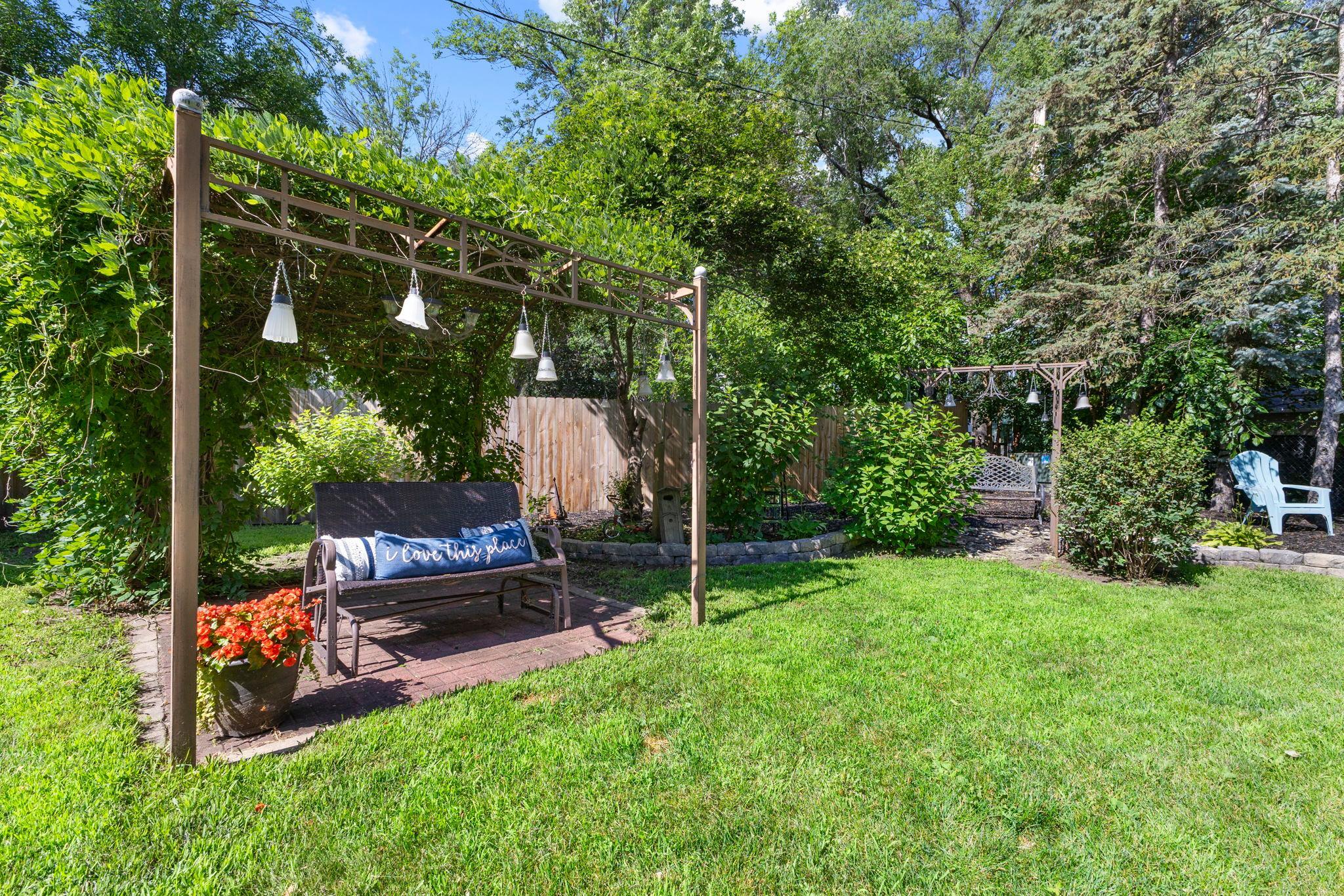 A partially covered seating area offers a peaceful escape in every season.