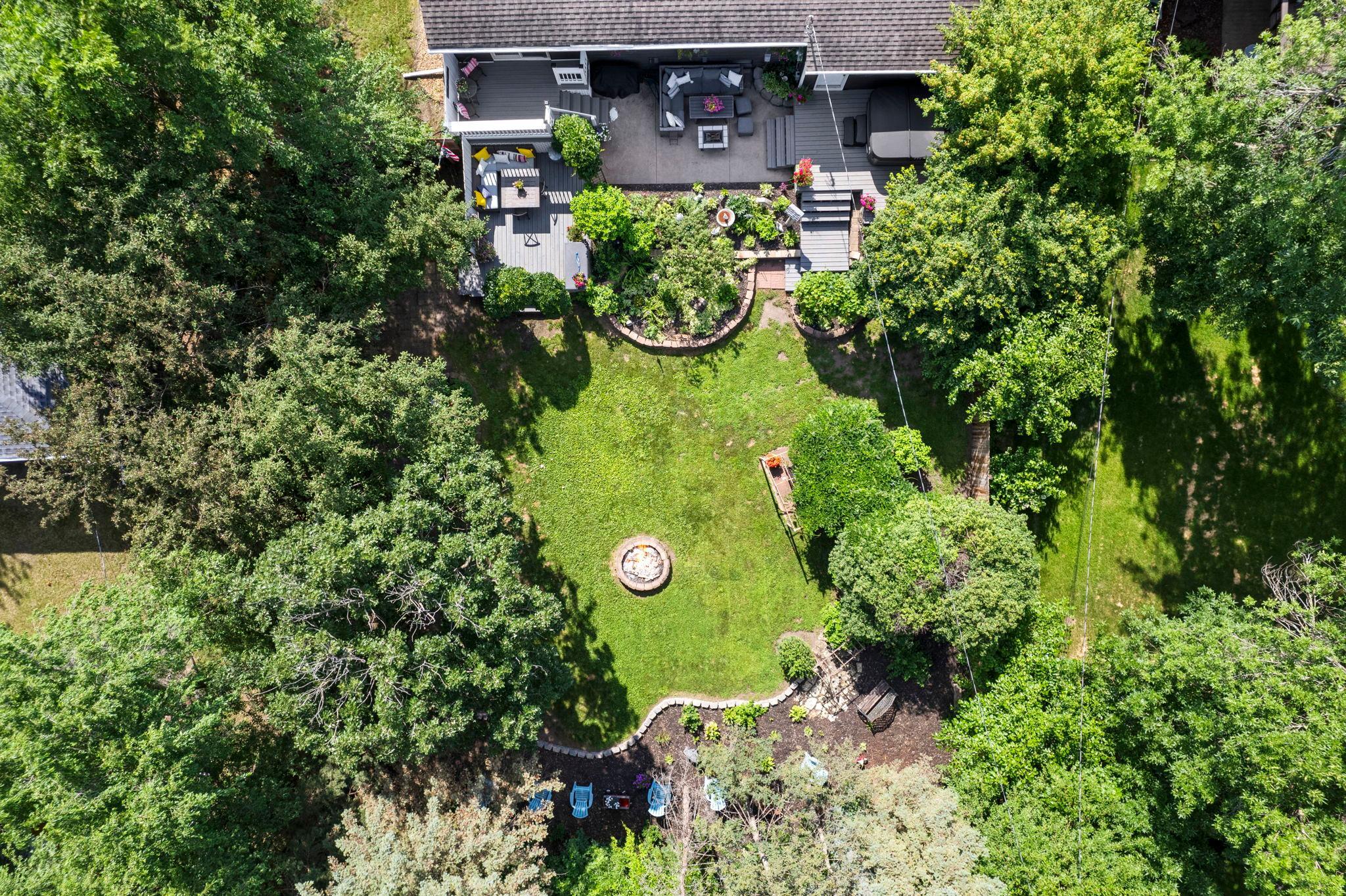 An aerial view highlights the beautifully landscaped backyard and outdoor entertaining areas.