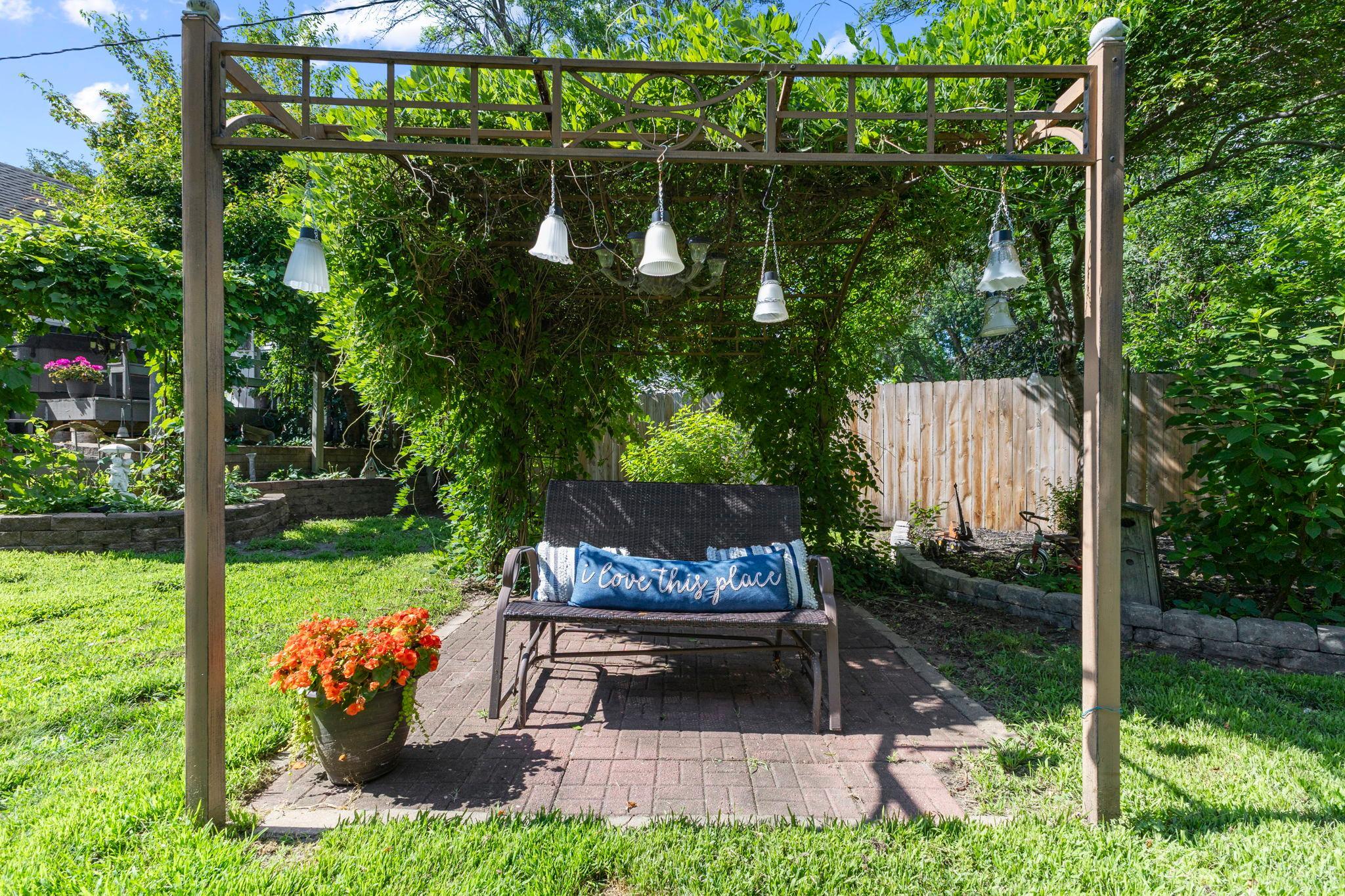 Lush landscaping surrounds the home, creating exceptional curb appeal from every angle.