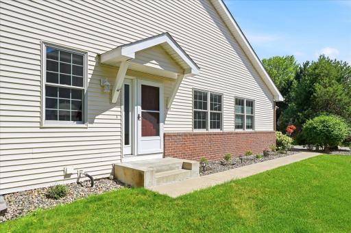 Welcome home to a private side entrance that enhances the single-family feel of this beautifully maintained end-unit townhome.