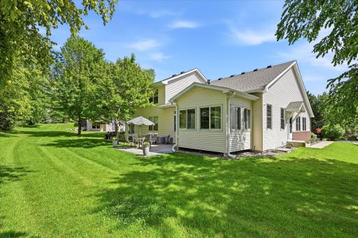 Beautifully maintained end-unit townhome offering true main-level living, expansive green space, and a peaceful outdoor setting in one of Chanhassen's most desirable locations.