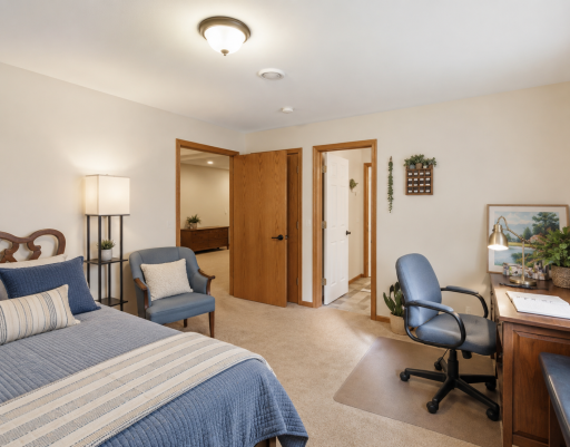 The spacious lower-level bedroom offers exceptional flexibility with room for both a comfortable guest retreat and a dedicated home office, complete with convenient access to the adjacent full bathroom.