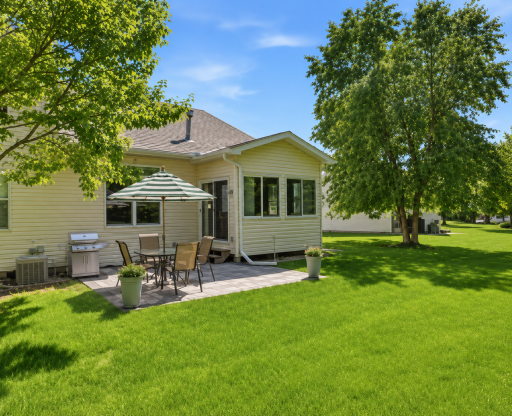 Step outside to your private paver patio overlooking expansive association-maintained green space and mature trees. The ideal setting for outdoor dining, summer grilling, morning coffee, or simply relaxing while enjoying the beautiful landscape