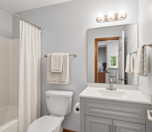 Beautifully updated full bathroom featuring a stylish vanity, modern fixtures, and a tub/shower combinationâperfect for guests or the adjacent main-level bedroom.