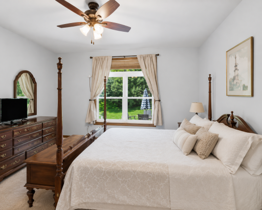 Designed as a comfortable retreat, the main-level owner's suite offers generous space, tranquil views, and the convenience of a private ensuite bath with a walk-in closet.