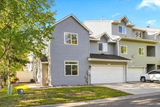 Fantastic End Unit with two car garage and green space.