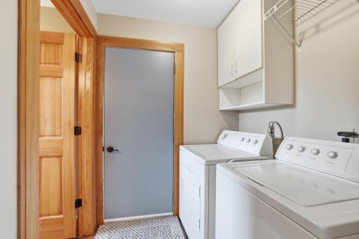 Main floor laundry & doors to the garage & 1/2 bathroom