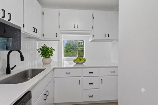 Remodeled kitchen with quartz counters and new stainless appliances
