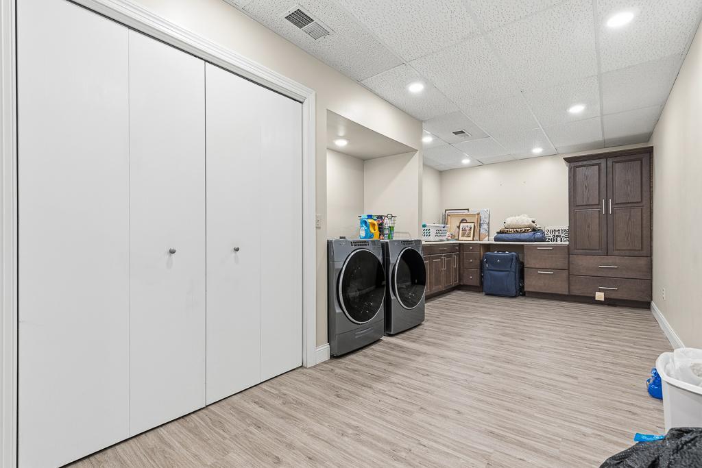 Huge dedicated laundry room! Abundant storage space for all your laundry and housecleaning needs