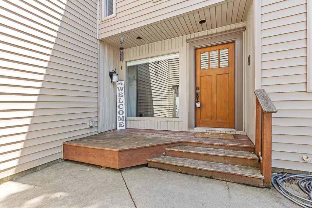 Welcoming covered front porch - the perfect spot for seasonal decor and planters!