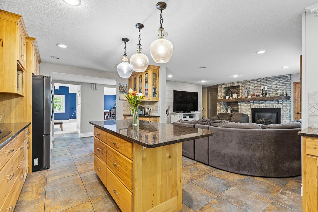 Kitchen is set amongst a main floor cozy living area and steps away from the large main living room. Either area could be utilized as dining room!