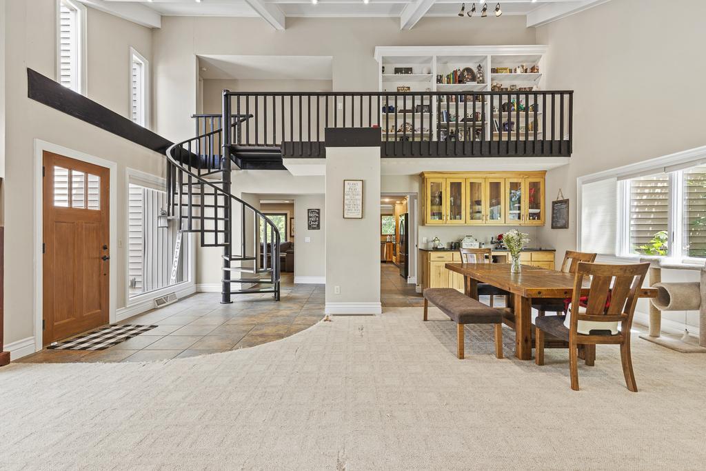 Stunning details around every corner - the sturdy spiral staircase leads to an overlooking balcony
