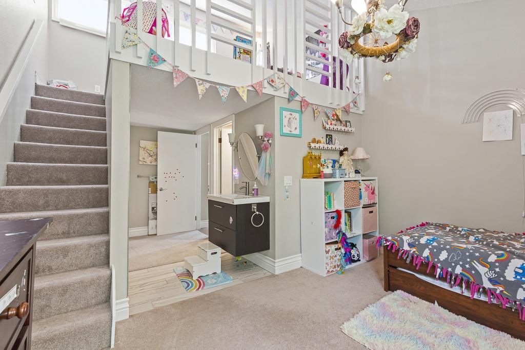 Each bedroom features a finished loft space accessible with stairways