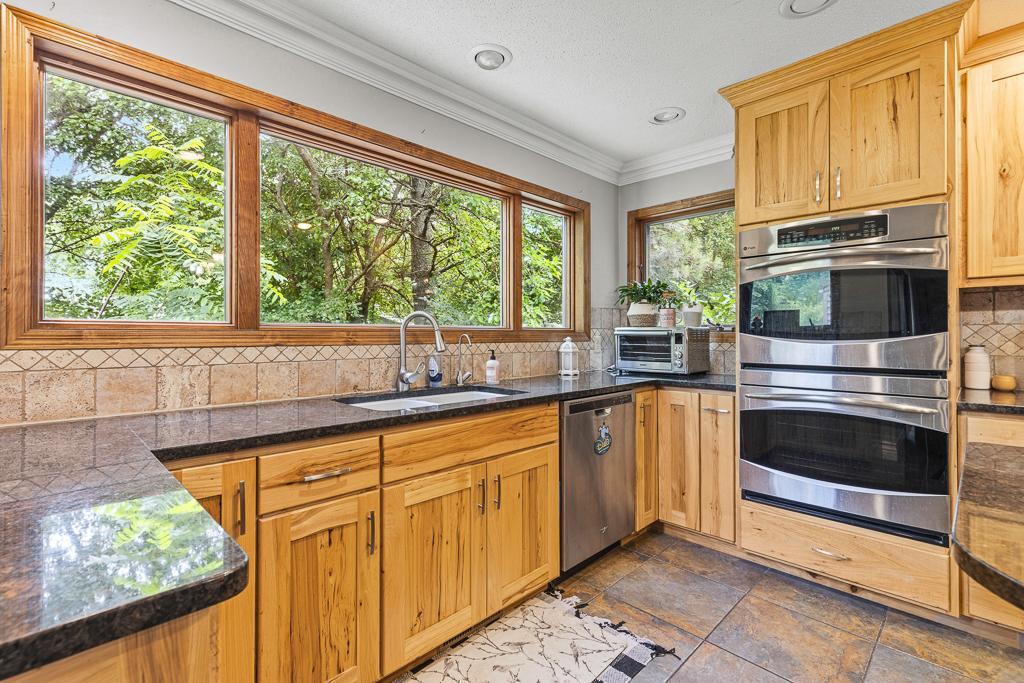 Kitchen sink surrounded by counterspace - tons of workspace for meal prepping