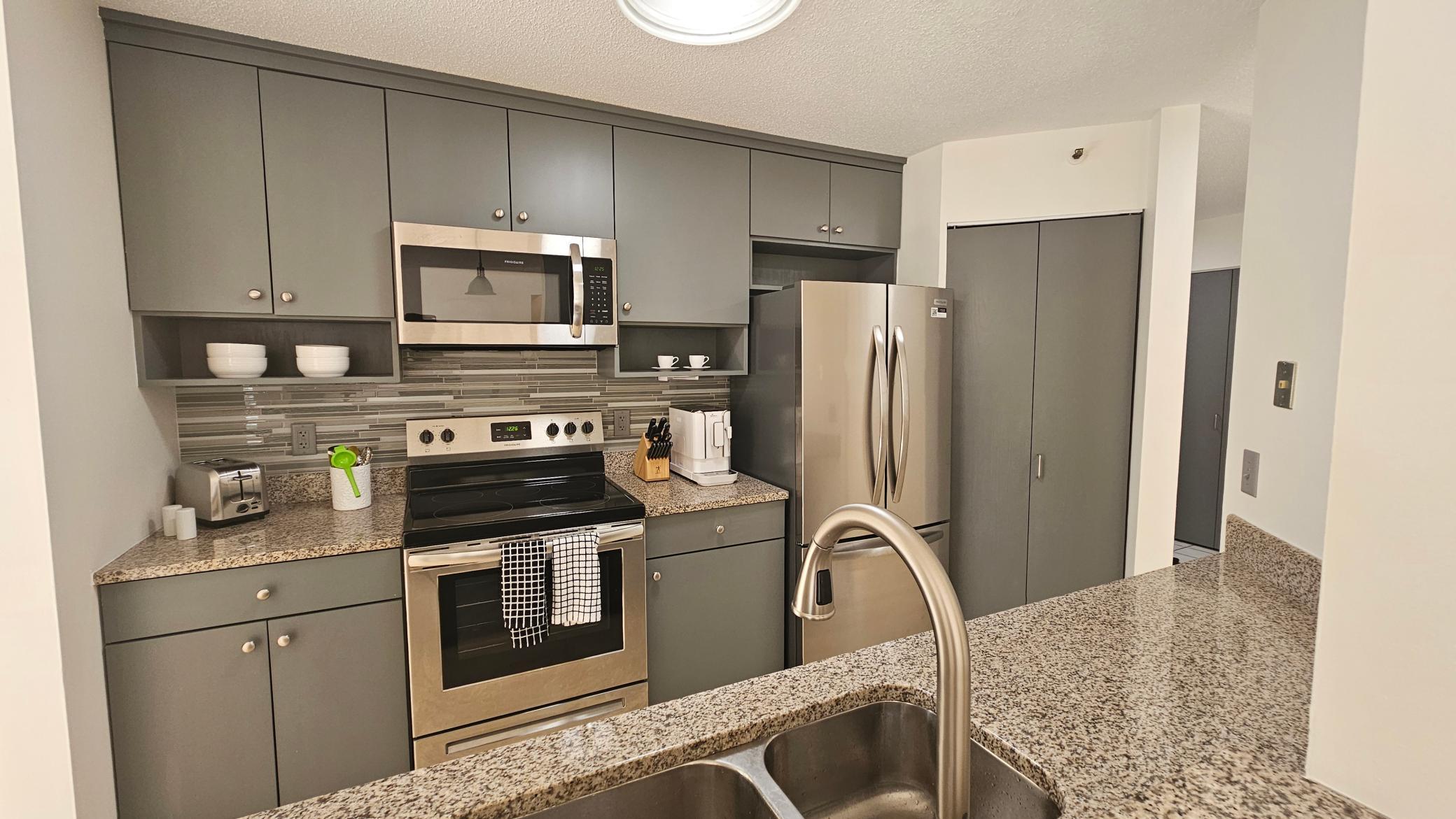 Designer kitchen featuring stainless steel appliances.jpg