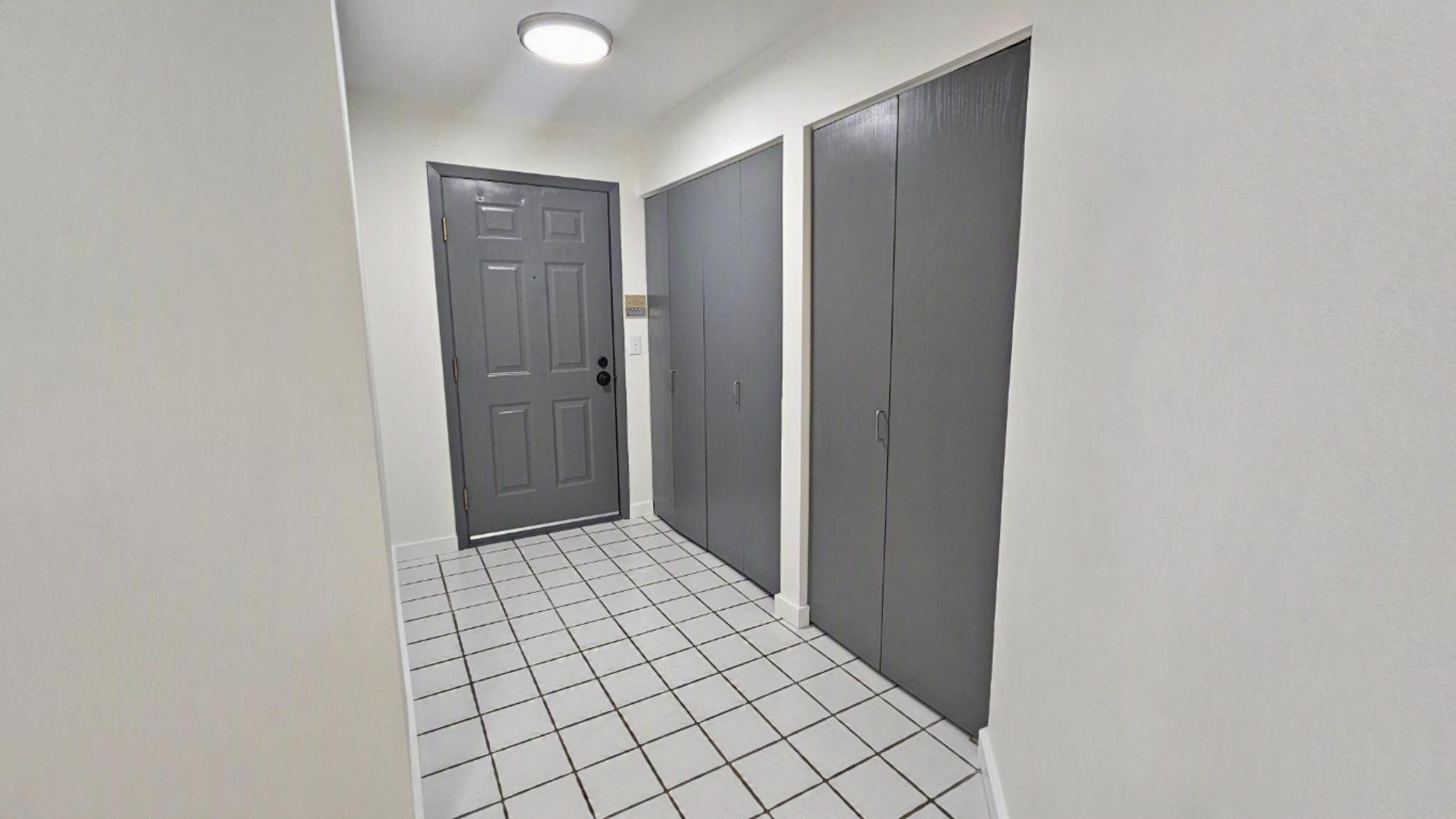 The main entry hall features abundant closet space.JPG