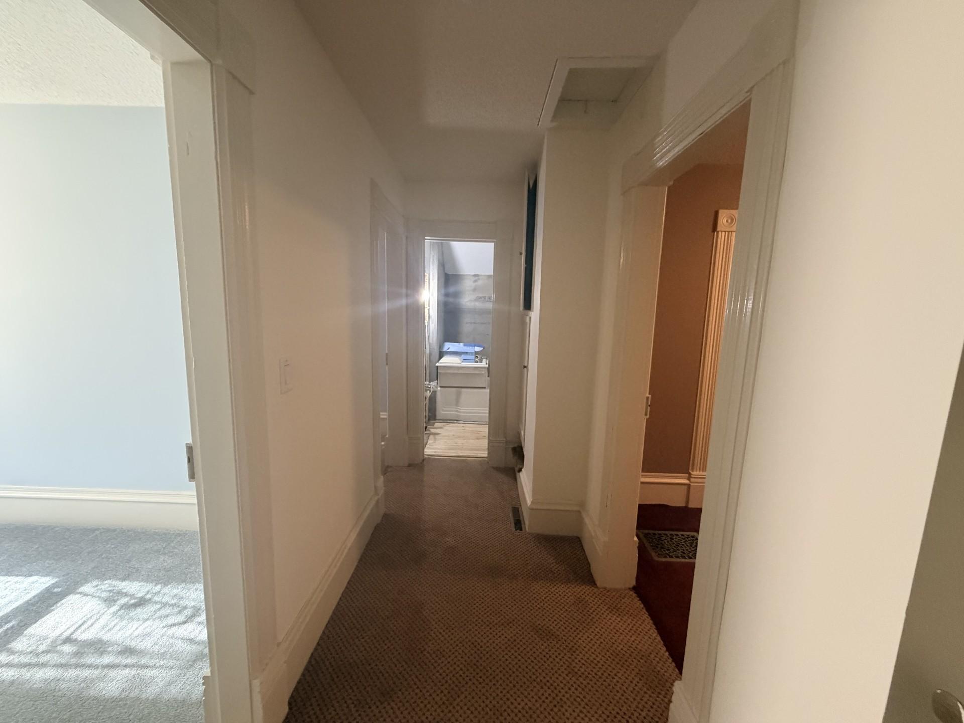 Three bedrooms and a full bath in the upper level