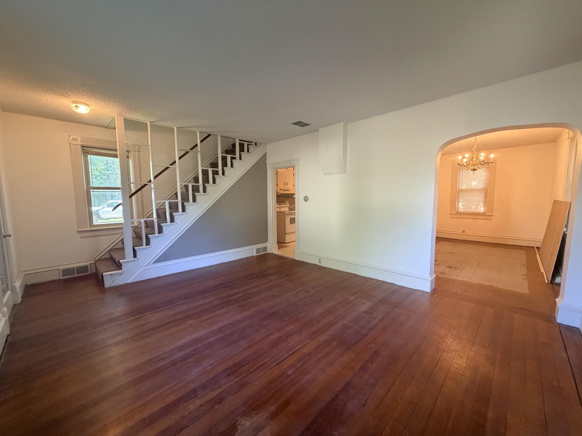 Living room with kitchen and dining room views