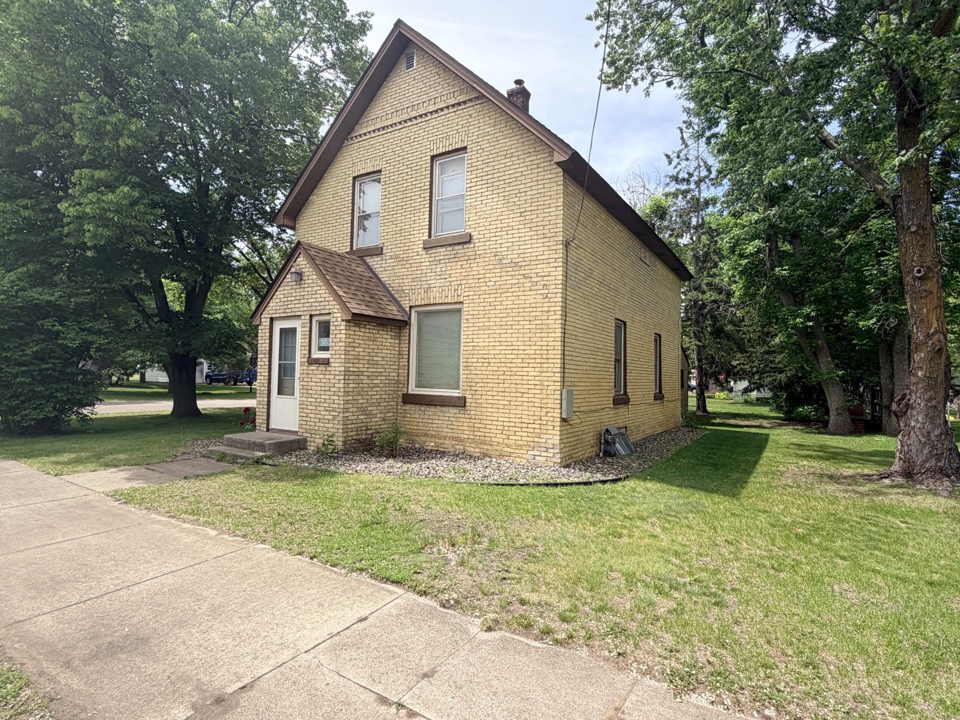 An adorable 1910 brick two story on a corner lot