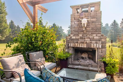 Large outdoor fireplace for cozy summer and fall nights