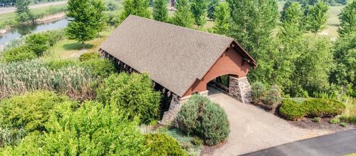 A signature covered bridge welcomes residents to miles of scenic walking trails that wind throughout The Territory's beautifully landscaped grounds.
