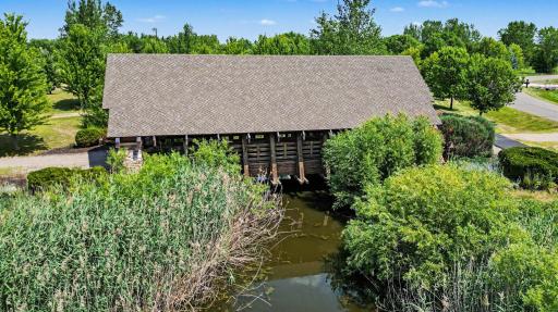 Picturesque walking trails meander through peaceful natural surroundings, connecting residents to parks, open green spaces, and neighborhood amenities.