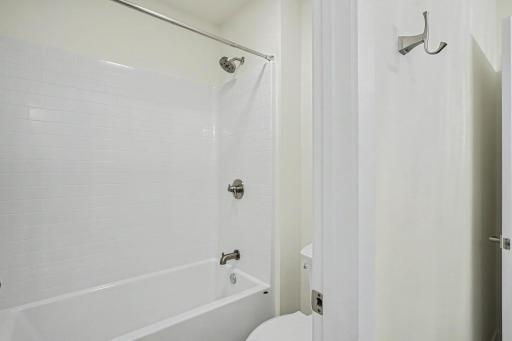 Full bathroom with a tub/shower combination, timeless finishes, and a thoughtfully designed layout ideal for family and guests.