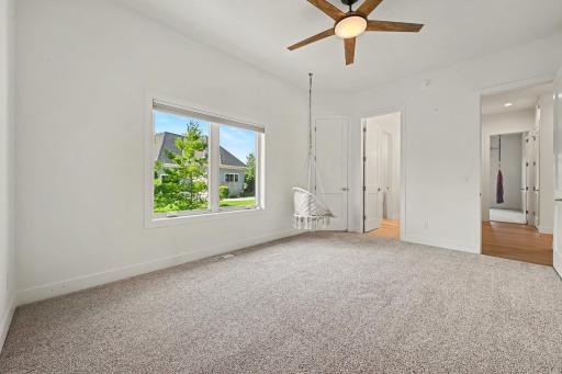 Two spacious main-level bedrooms, each offering generous closets and connected by a beautifully appointed Jack-and-Jill bathroom.