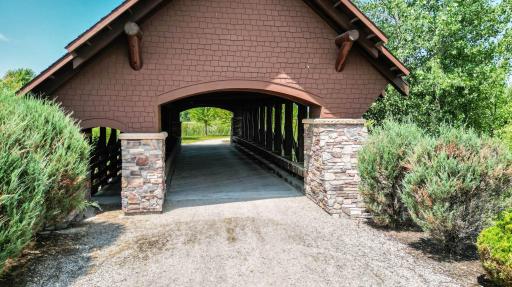 Iconic covered bridge serves as both a neighborhood landmark and gateway to The Territory's extensive trail system and tranquil outdoor recreation.