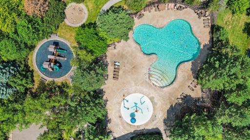 Resort-inspired community pool with an adjoining splash pad provides fun and recreation for all ages throughout the summer.