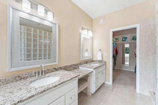 Primary Bathroom with Dual Sinks and walk in Closet