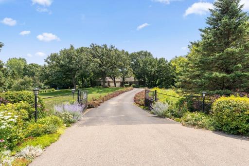Winding Driveway to Home-Fenced Yard and Entrance