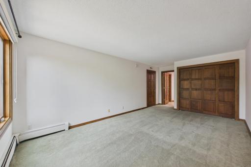 Primary bedroom with two large closets (one in bath and one in bedroom) and private bath.