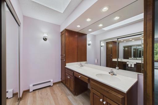 Primary bath features double sinks and another closet!