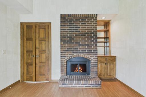 The second bedroom has a cozy fireplace. Many people use this as an office or den.