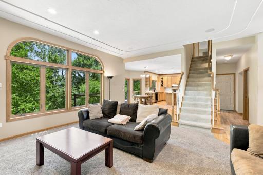 Large windows in the living room and kitchen share views of the golf course