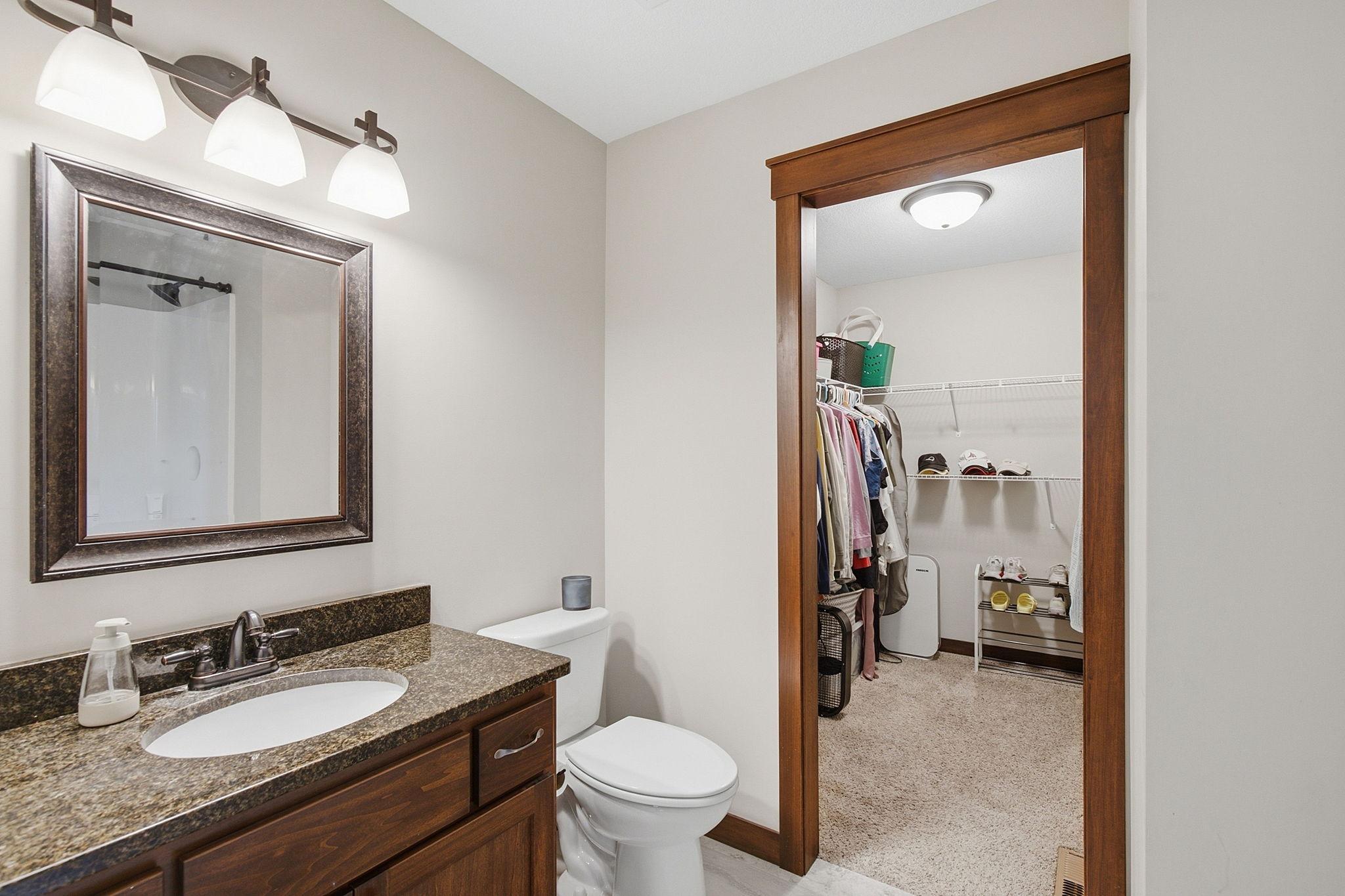 Bathroom with walk in closet