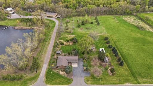 This property goes back to the far tree line and the evergreens to the west are on the property