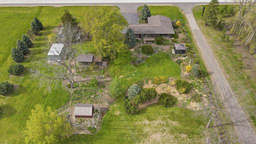 Great view of all the outbuildings including a She Shed and Walk in Cooler - possibilities are endless!