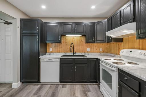 Dont like the dark contrast cabinets? Talk to us about having them painted prior to closing?