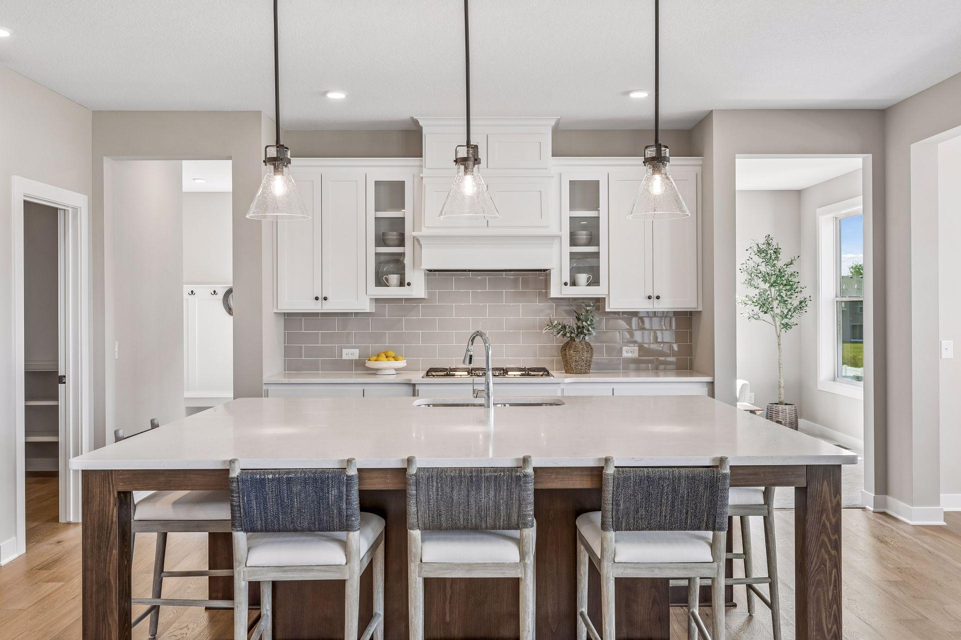 Our gourmet kitchen defines how the WOW comes standard. With a huge center island, granite countertops, gas cook top, and double ovens, plus so much more!