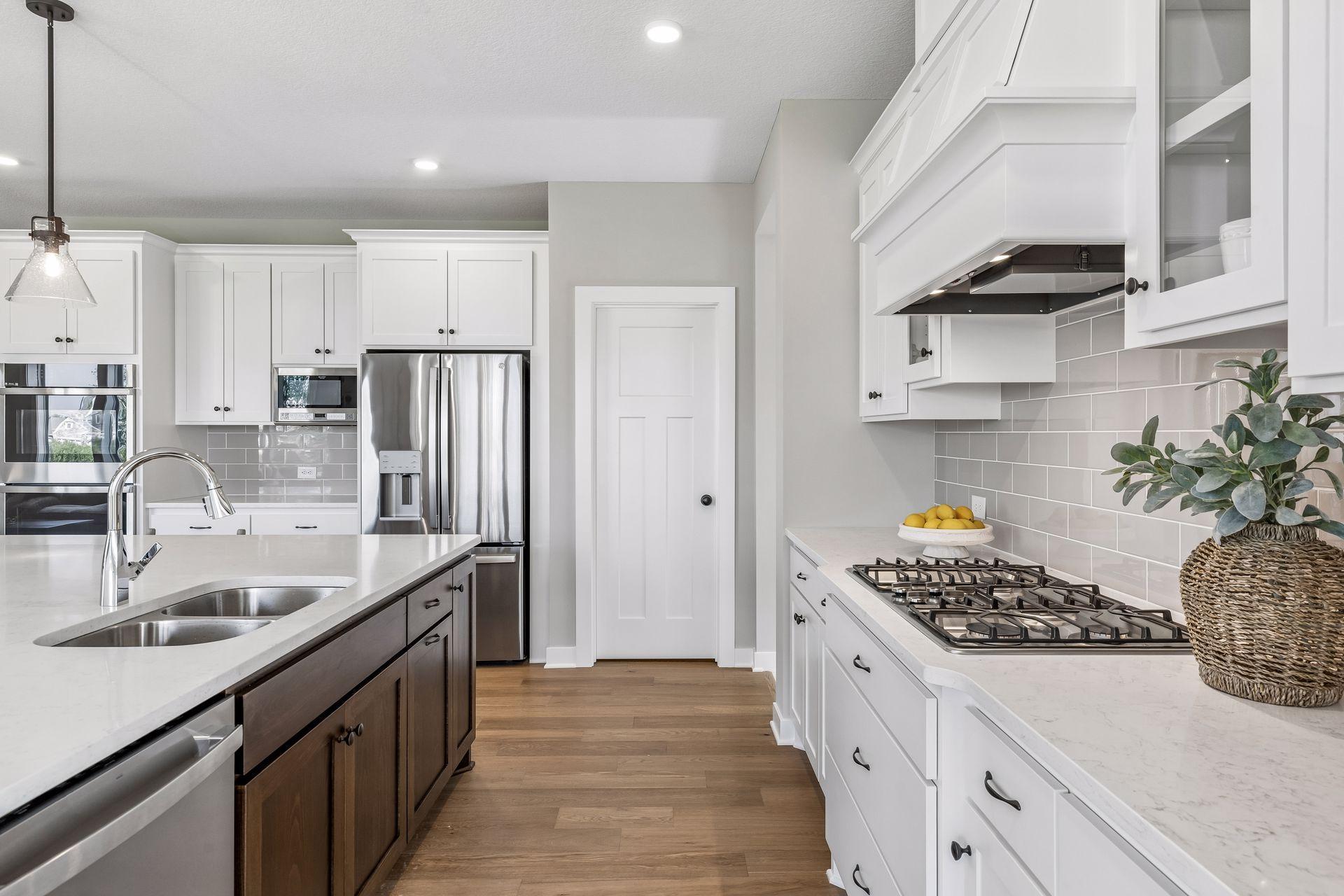 All our features are standard including the granite countertops, tile backsplash and under mount kitchen sinks.
