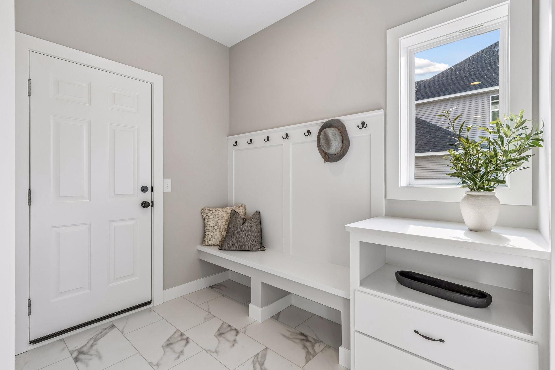 The spacious mud room helps your home stay organized.