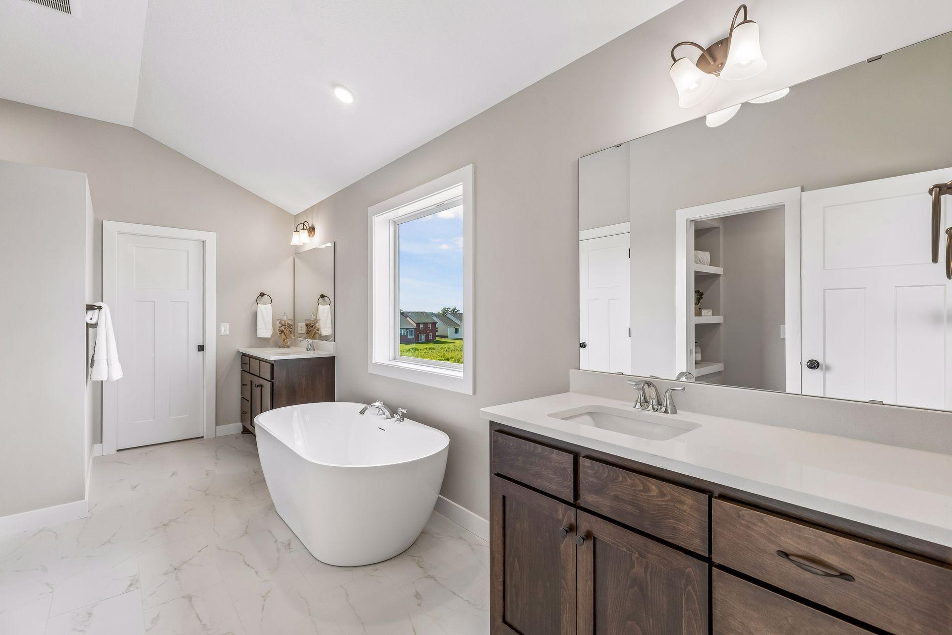The luxurious, private bath comes with a freestanding tub.