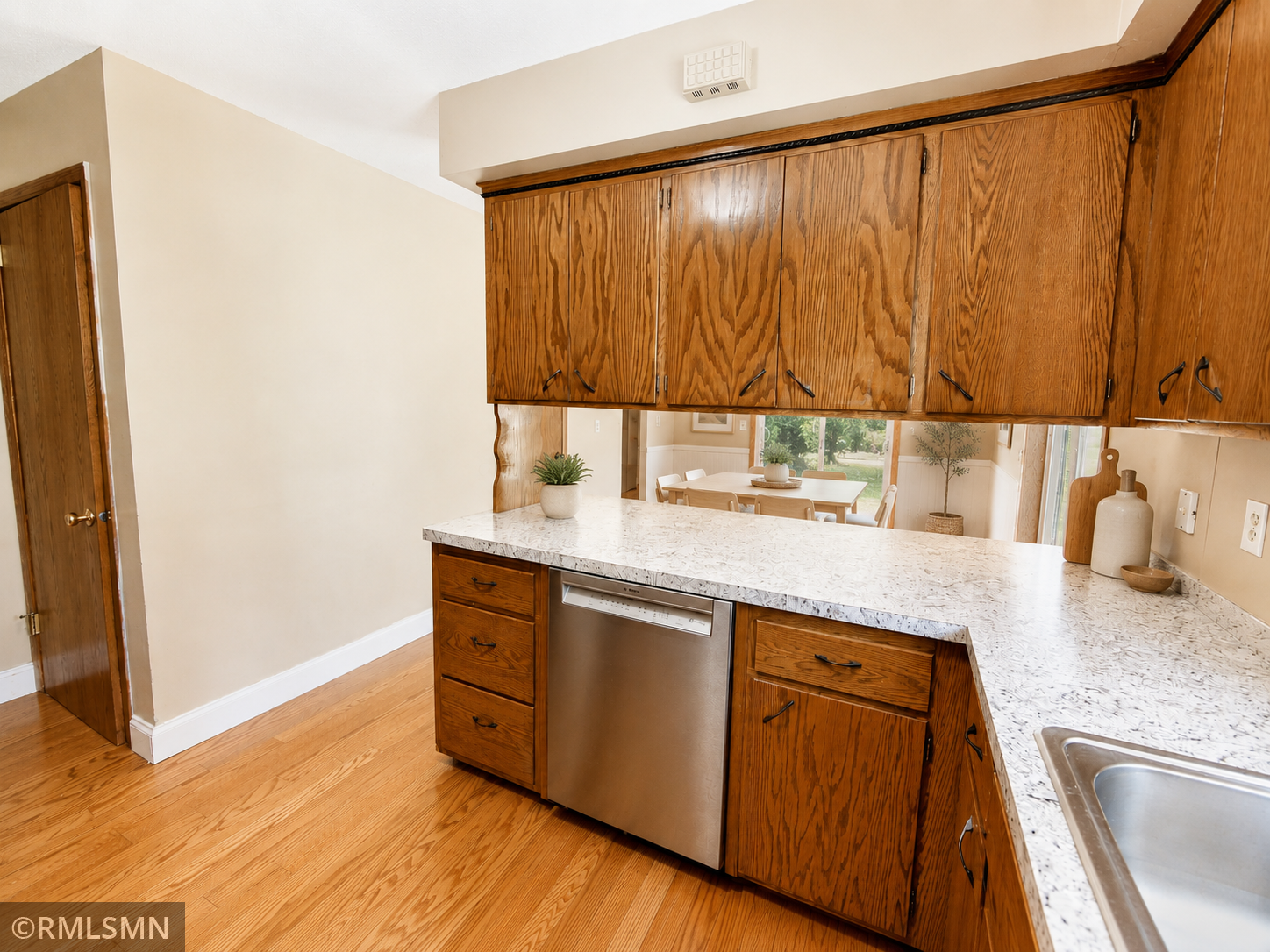 #17-Irving-Spacious Kitchen with plants lookin ginto dining room.png