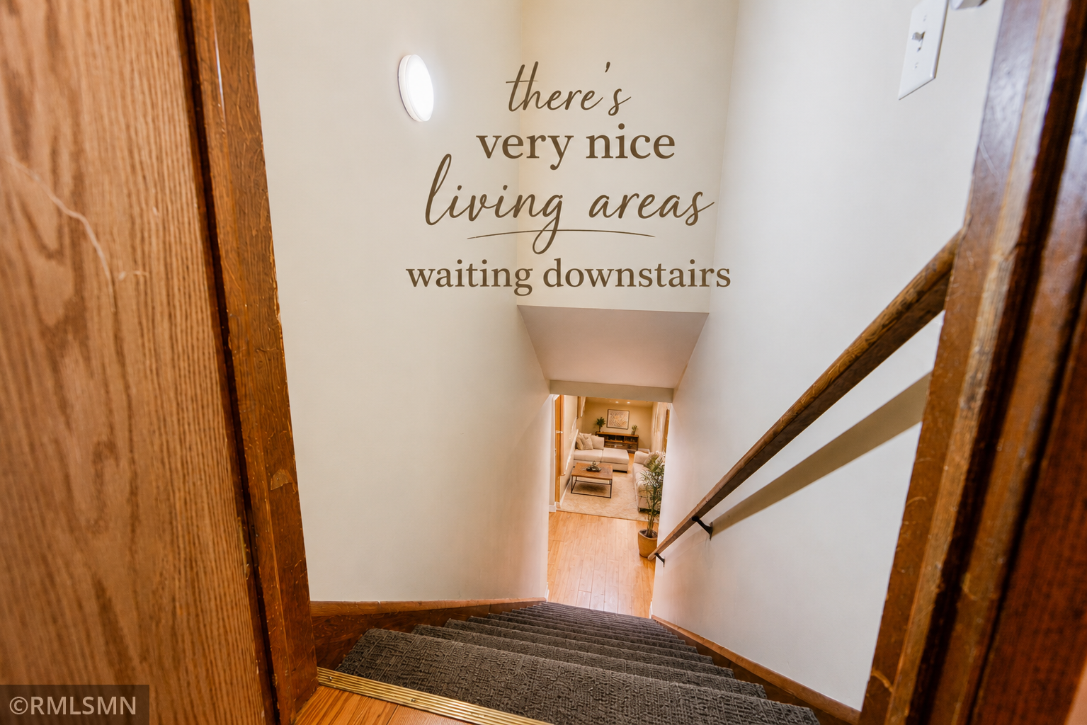 #23-Welcoming Carpeted Stairs to lower level living .png