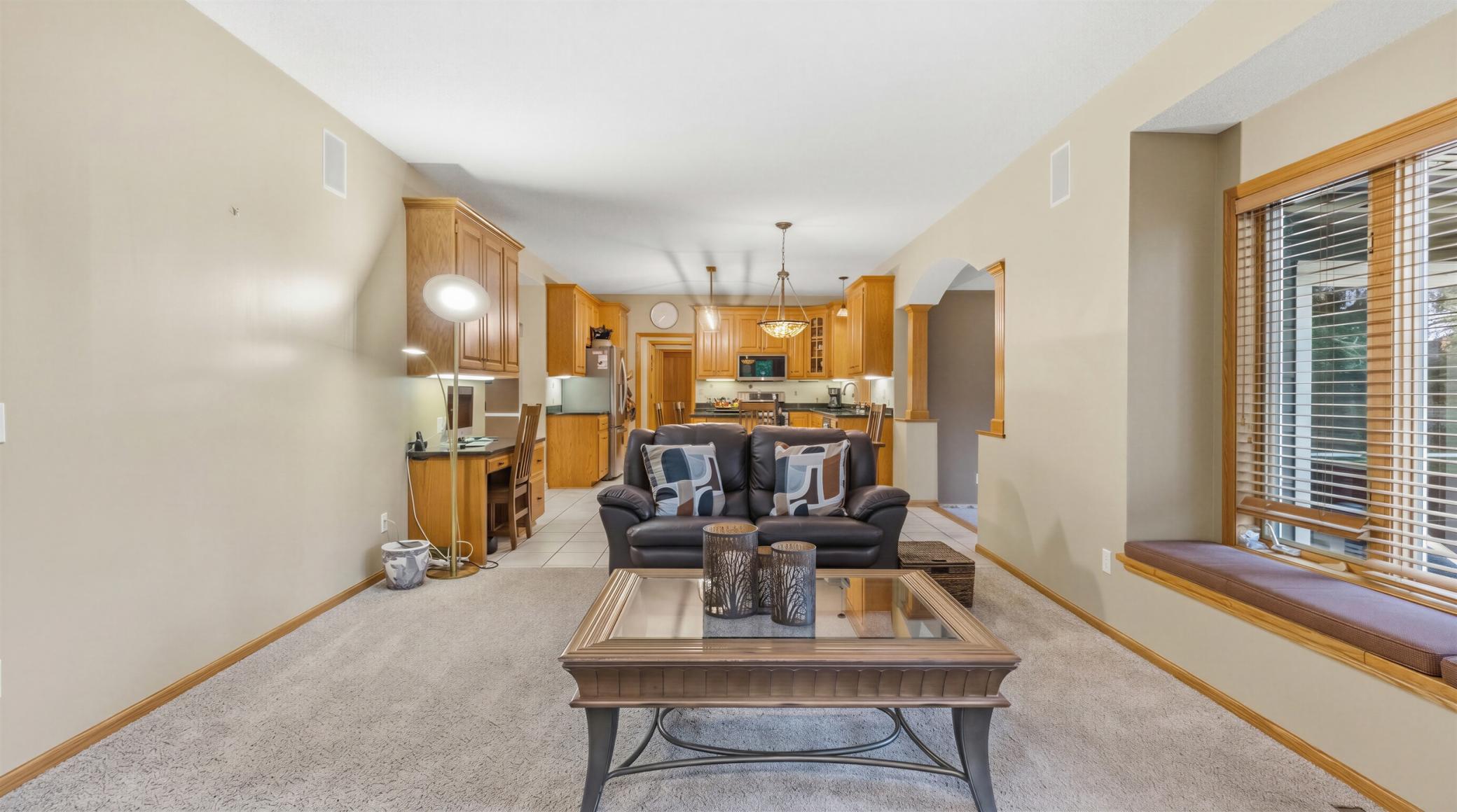 A different angle of the family room to show the informal dining and kitchen.