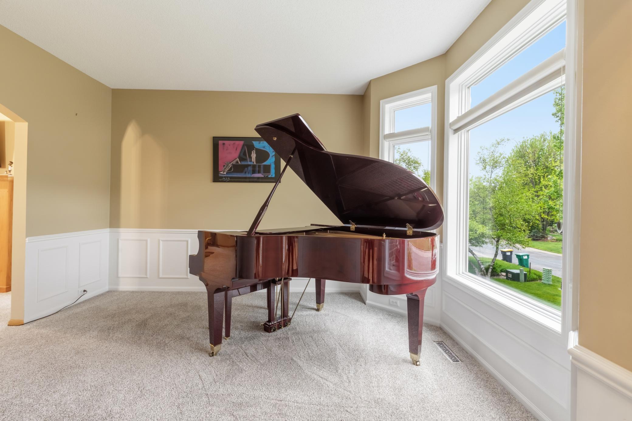 The living room in the main level, currently used as a music area.