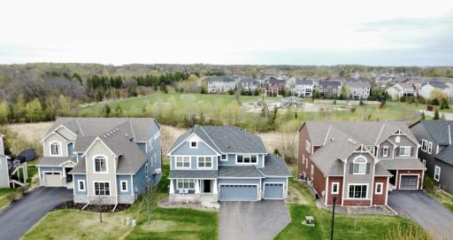 Overlooking scenic green space and neighborhood park, this home offers a connected yet peaceful setting